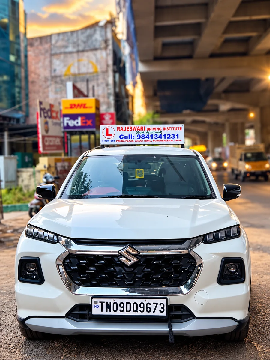 Rajeswari Driving Institute premium white Suzuki training car