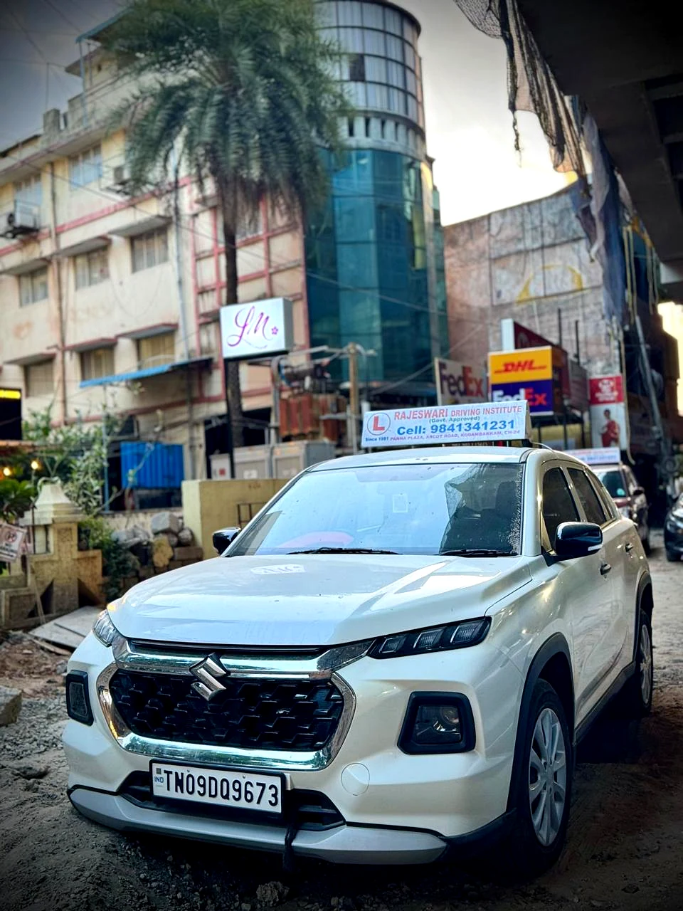Rajeswari Driving Institute white training car in Kodambakkam