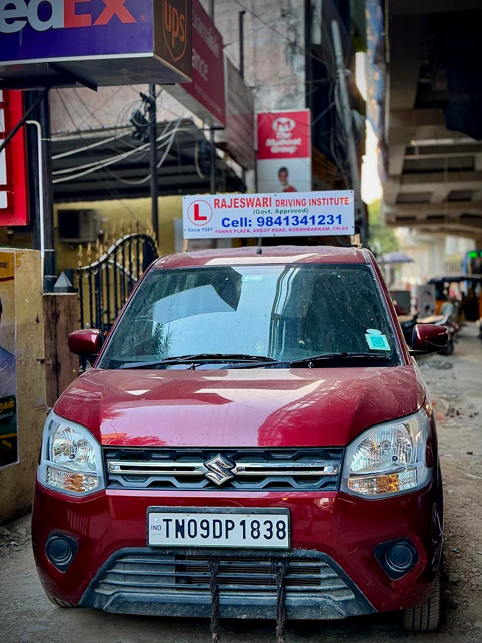 Maroon Rajeswari Driving Institute training car